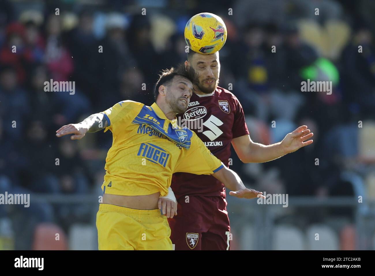 Frosinone, Italy. 10th Dec, 2023. Torino's Croatian midfielder Nikola Vlasic challenges for the ball with Frosinone's Italian midfielder Francesco Gelli during the Serie A football match between Frosinone Calcio vs Torino at the Benito Stirpe stadium in Frosinone, Italy on December 10, 2023. Credit: Independent Photo Agency/Alamy Live News Stock Photo