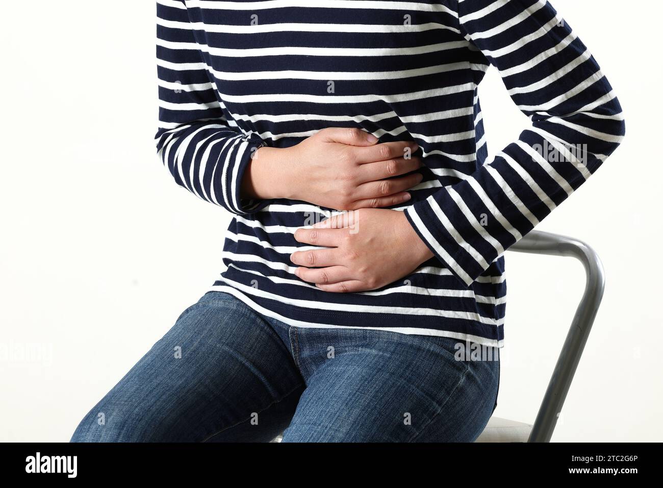 young woman suffering from stomach pain,closeup. food poisoning,cramps
