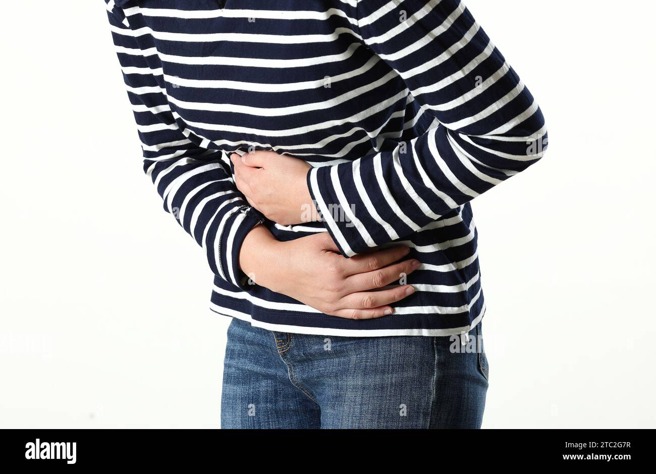 young woman suffering from stomach pain,closeup. food poisoning,cramps