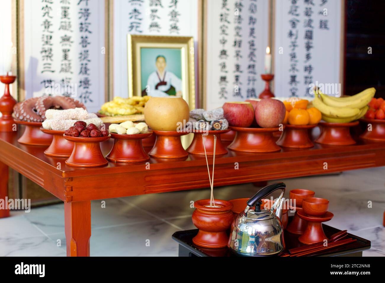 Incense sticks burn during a Korean Charye ceremony, symbolizing respect and remembrance for