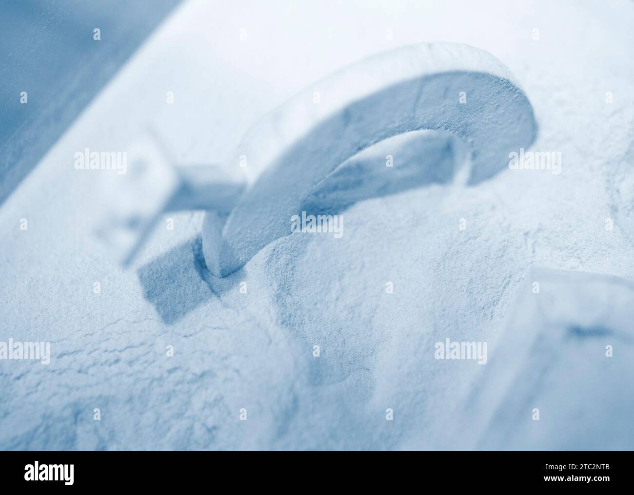 Objects printed on a 3D printer from powdered polyamide lying in white polyamide powder. Models