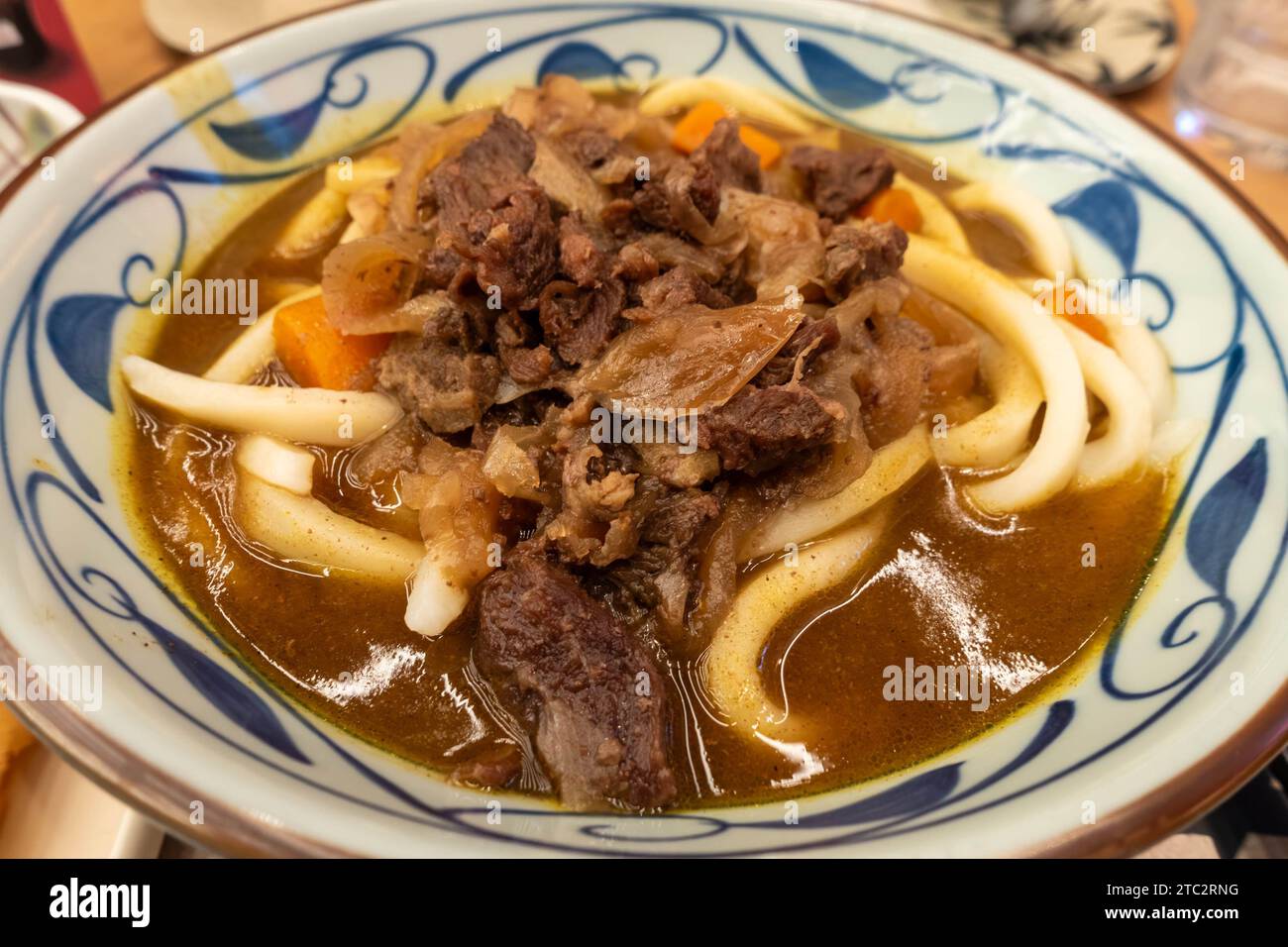A bowl of Japanese udon noodles in a broth with beef Stock Photo Alamy