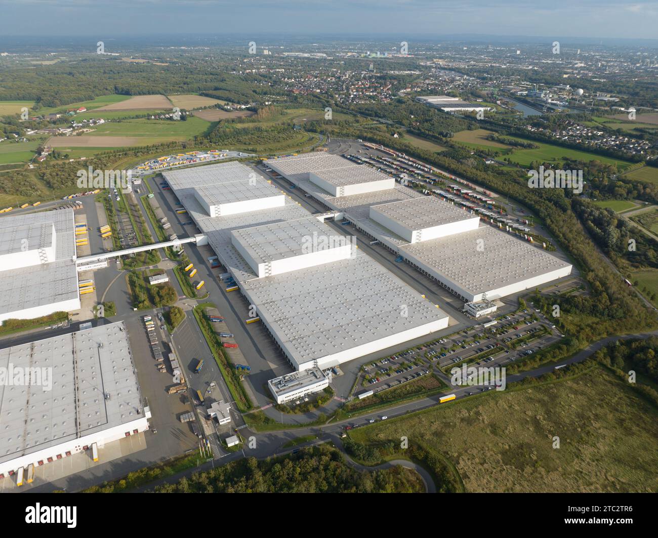 Aerial drone view on a large distribution center, product warehouse and shipping. Stock Photo