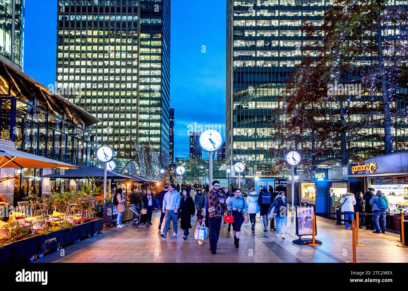 People Walking Along Outside Cabot Square In Canary Wharf London UK Stock Photo