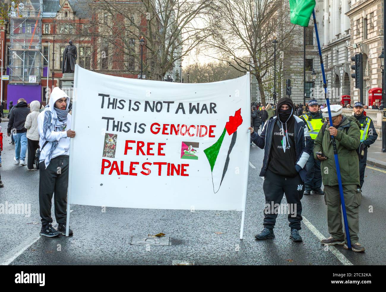 London / UK - Dec 9 2023: Masked pro-Palestinian protesters hold a ...