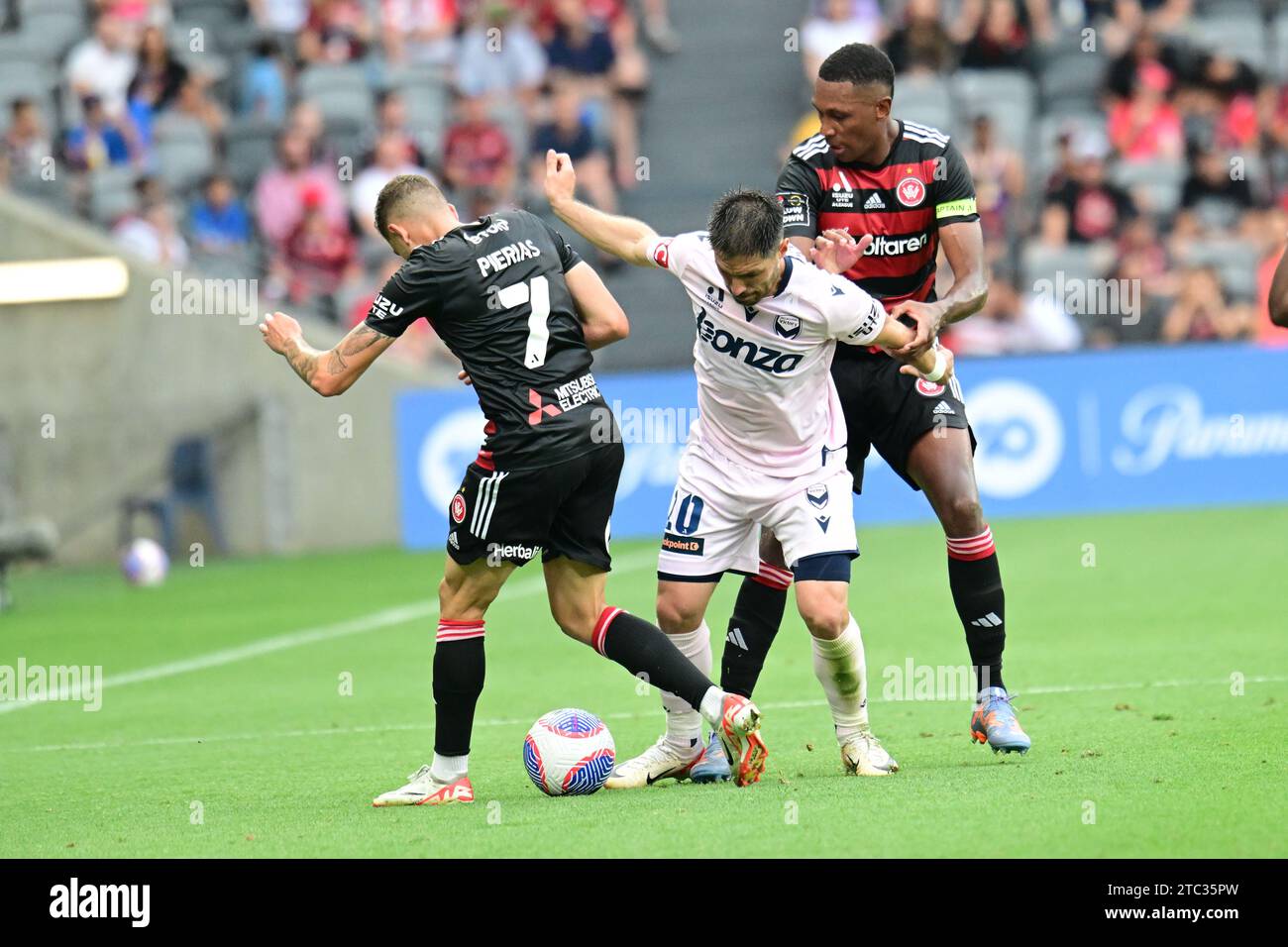 Parramatta, Australia. 10th Dec, 2023. Dylan Pierias (L), Marcelo (R) of Western Sydney Wanderers FC and Bruno Fornaroli Mezza (R) of Melbourne Victory FC are seen in action during the A-League 2023/24 season round 7 match between Western Sydney Wanderers FC and Melbourne Victory FC held at the CommBank Stadium. Final score; Melbourne Victory 4:3 Western Sydney Wanderers. Credit: SOPA Images Limited/Alamy Live News Stock Photo