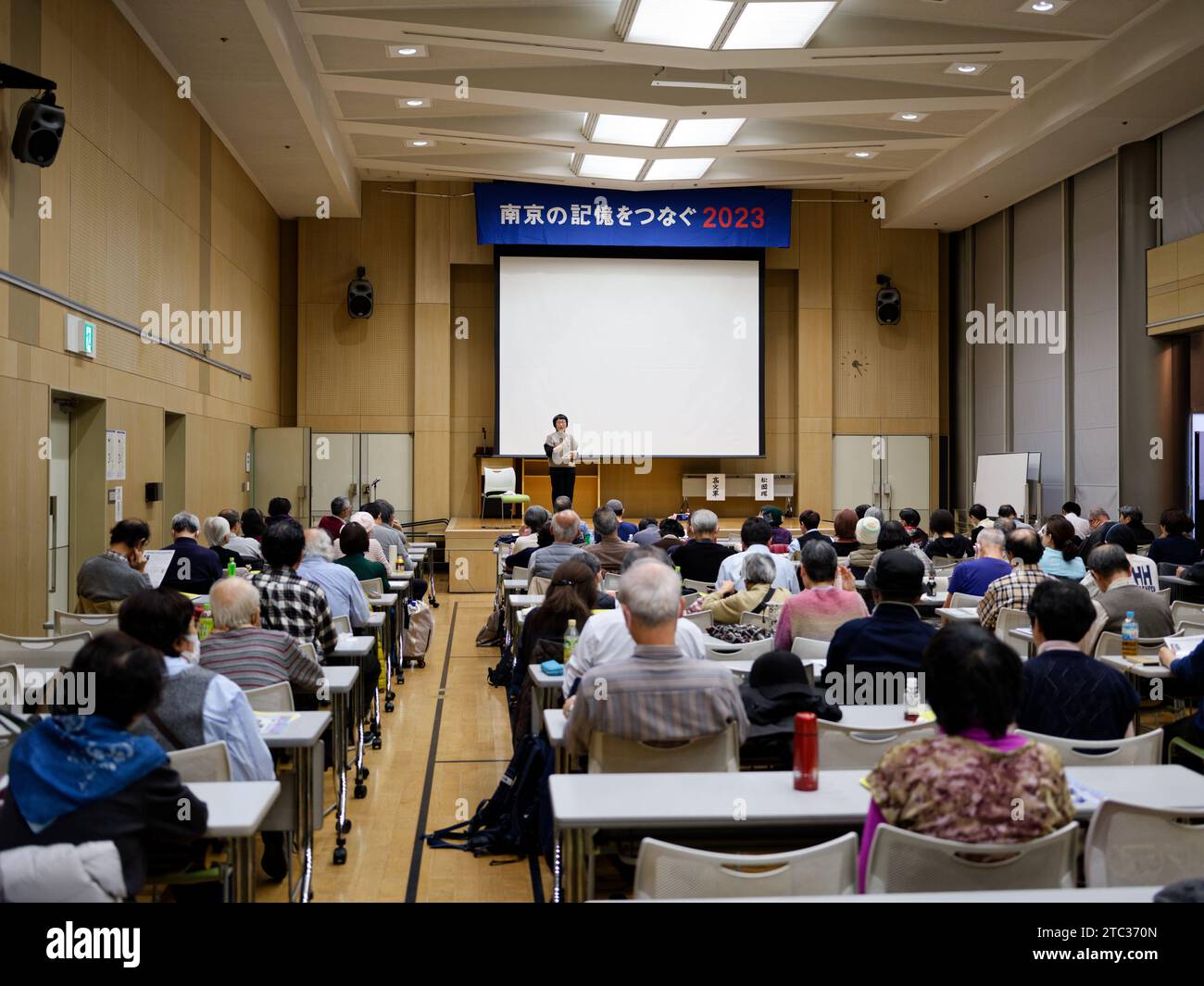 Osaka, Japan. 9th Dec, 2023. Tamaki Matsuoka, founder of the "Connecting Memories of Nanjing" civil group, delivers a speech during a gathering in Osaka, Japan, Dec. 9, 2023. A local civil group has held the gathering urging the Japanese public to reflect on the historical lessons and contemporary significance of the Nanjing Massacre in light of the current global situation, emphasizing the importance of not forgetting history in building peace. Credit: Zhang Xiaoyu/Xinhua/Alamy Live News Stock Photo