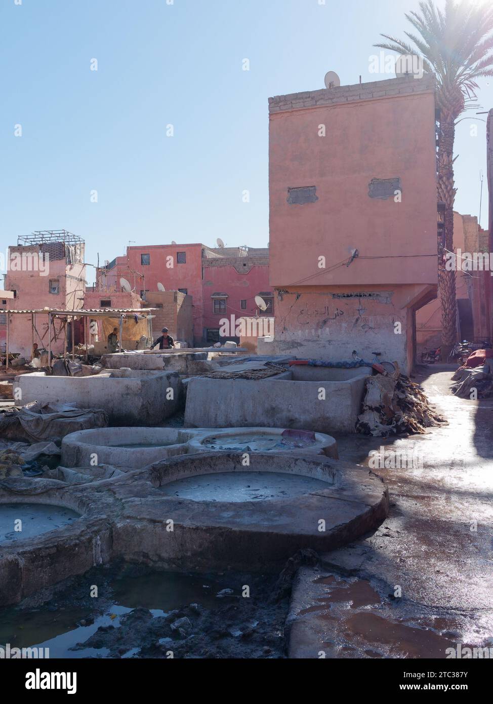 Tannery in the city of Marrakesh aka Marrakech with Mosque in the distance, Morocco, December 10, 2023 Stock Photo