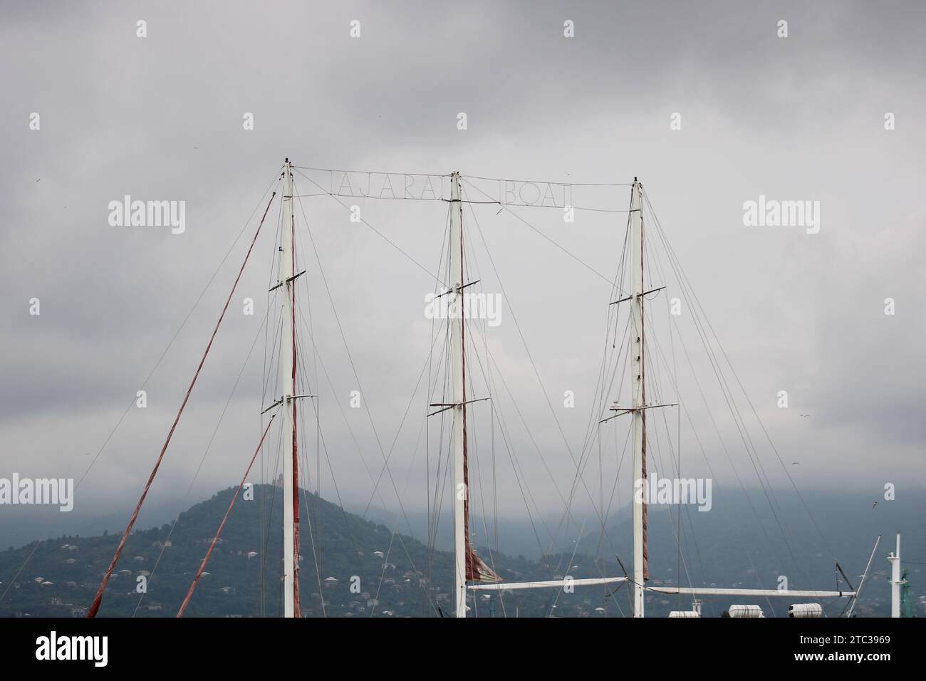 Lots of boat masts in a marina with cloudy sky background Stock Photo ...