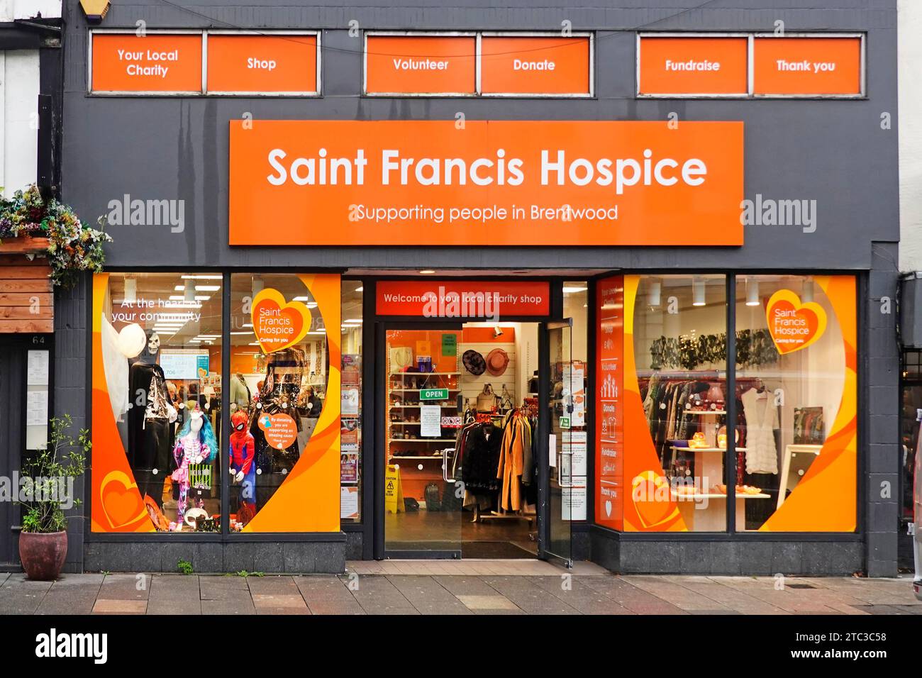 Saint Francis Hospice a charity shop front windows sells second-hand merchandise fundraising for palliative care for people in Brentwood Essex UK Stock Photo