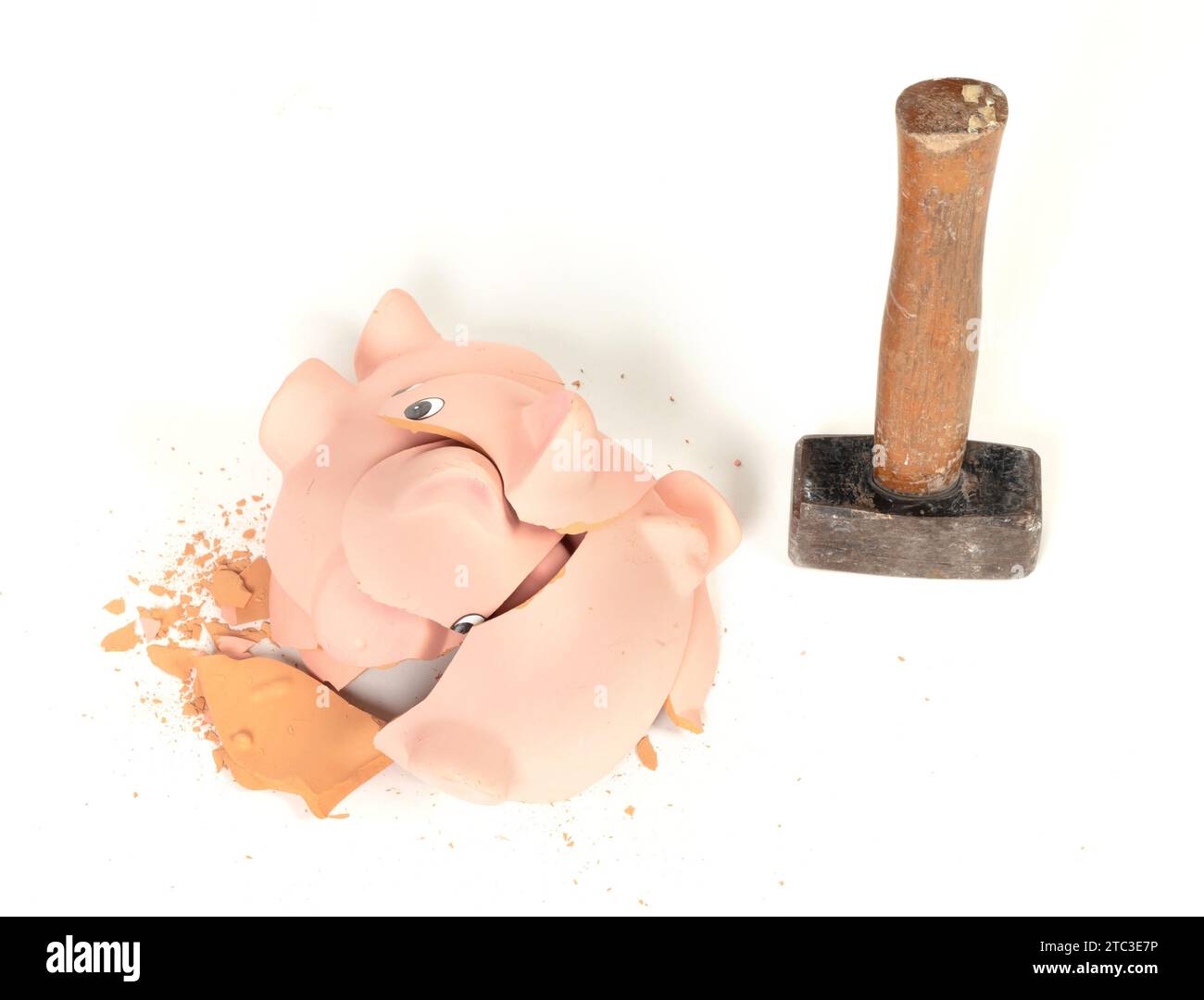 Hammer breaking piggy bank isolated on white Stock Photo - Alamy