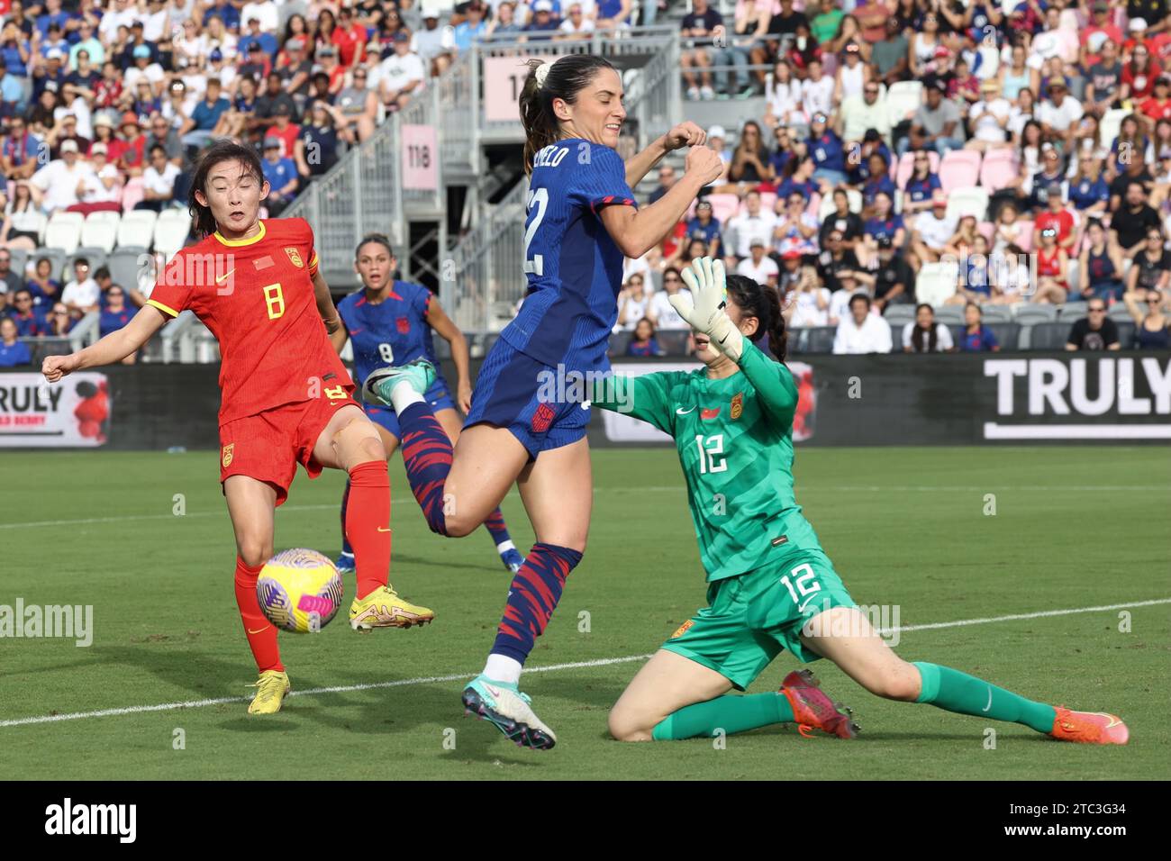 United States Women’s National Team midFielder Savannah DeMelo (22) tries to score as China PR goalie Xu Huan (12) and China PR defender Yao Wei (8) defend at DRV PNK Stadium on December 2, 2023 in Ft. Lauderdale, FL.  United States defeated China PR 3-0 (Credit: Paul Fong/Image of Sport) Stock Photo