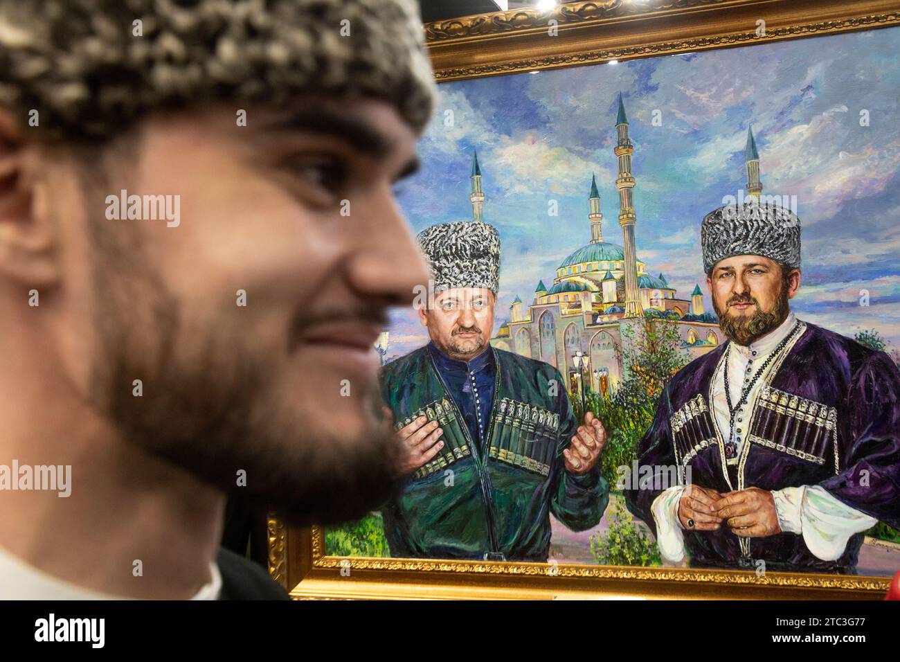 Moscow, Russia. 10th of December, 2023. A painting of Chechnya's First President Akhmat Kadyrov and Chechen Republic Head Ramzan Kadyrov is seen at the opening of Chechen Republic Day during the Russia Expo international exhibition and forum at the VDNKh exhibition centre in Moscow, Russia. Credit: Nikolay Vinokurov/Alamy Live News Stock Photo
