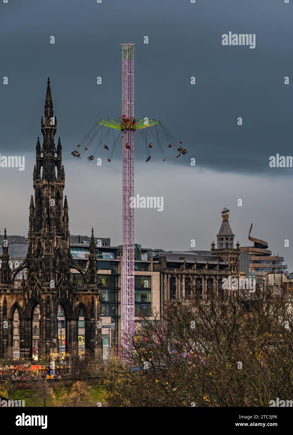 Fairground ride star flyer and Scott monument at Edinburgh Christmas