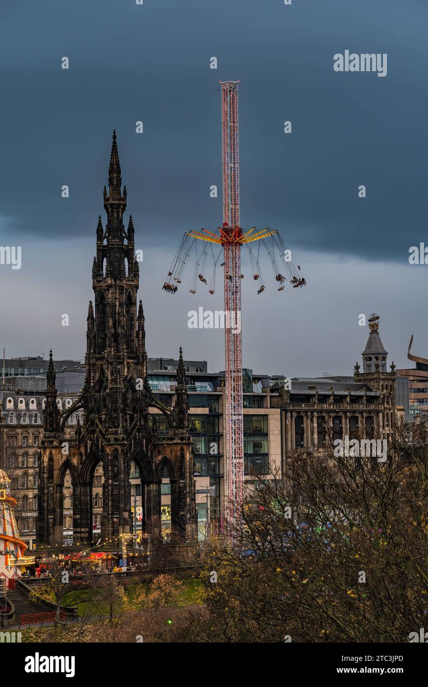 Fairground ride star flyer and Scott monument at Edinburgh Christmas
