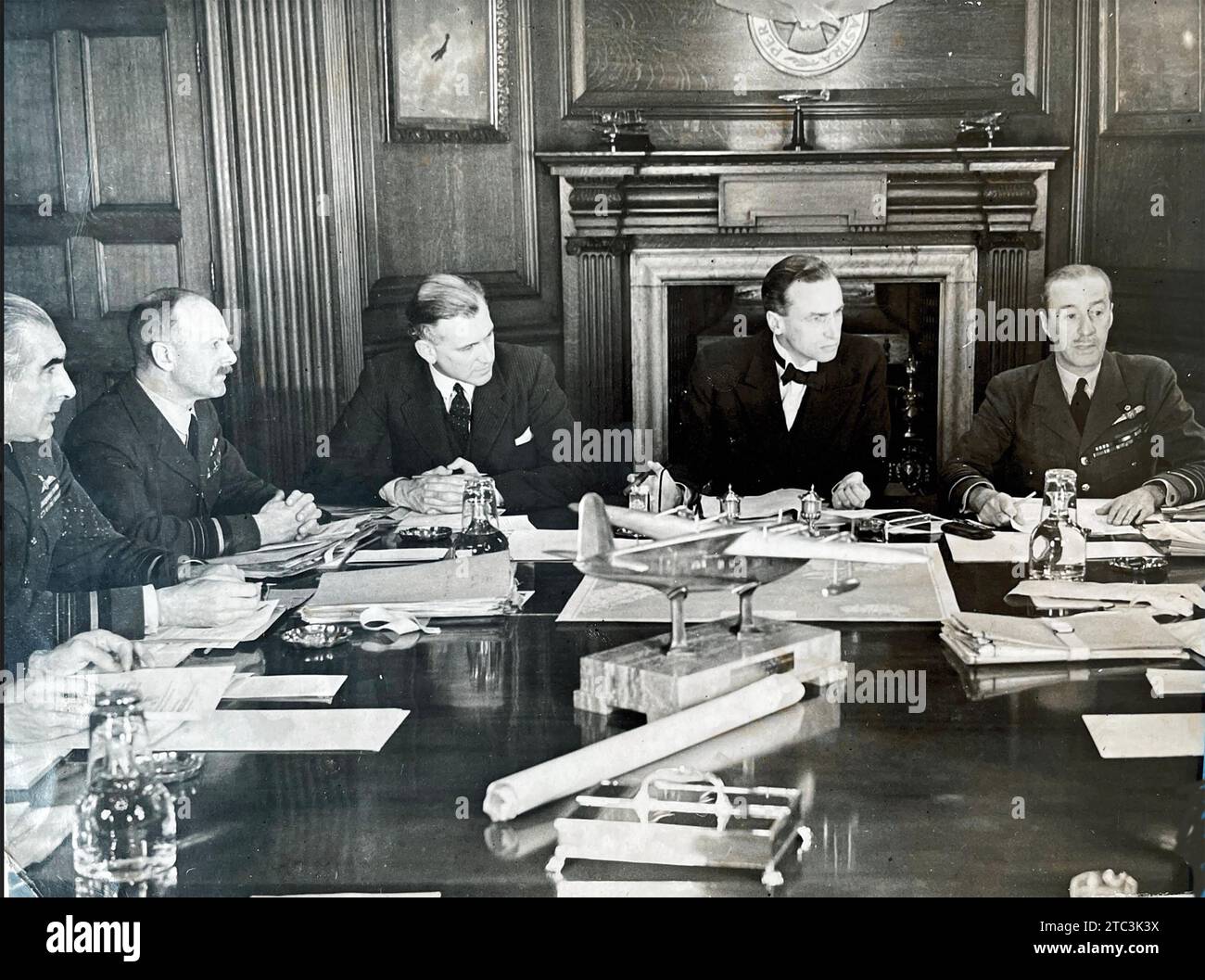 BRITISH AIR COUNCIL IN SESSION  at the Air Ministry in London, July,1940. From Left: Air Marshal Sir Christopher Courtney (Air Member for Supply and Organisation), Air Marshall  E.L. Gossage (Air Member for Personnel), Capt. H.H. Balfour (Under Secretary of State for Air) , Sir Archibald Sinclair (Secretary  of State for Air, unknown. Stock Photo