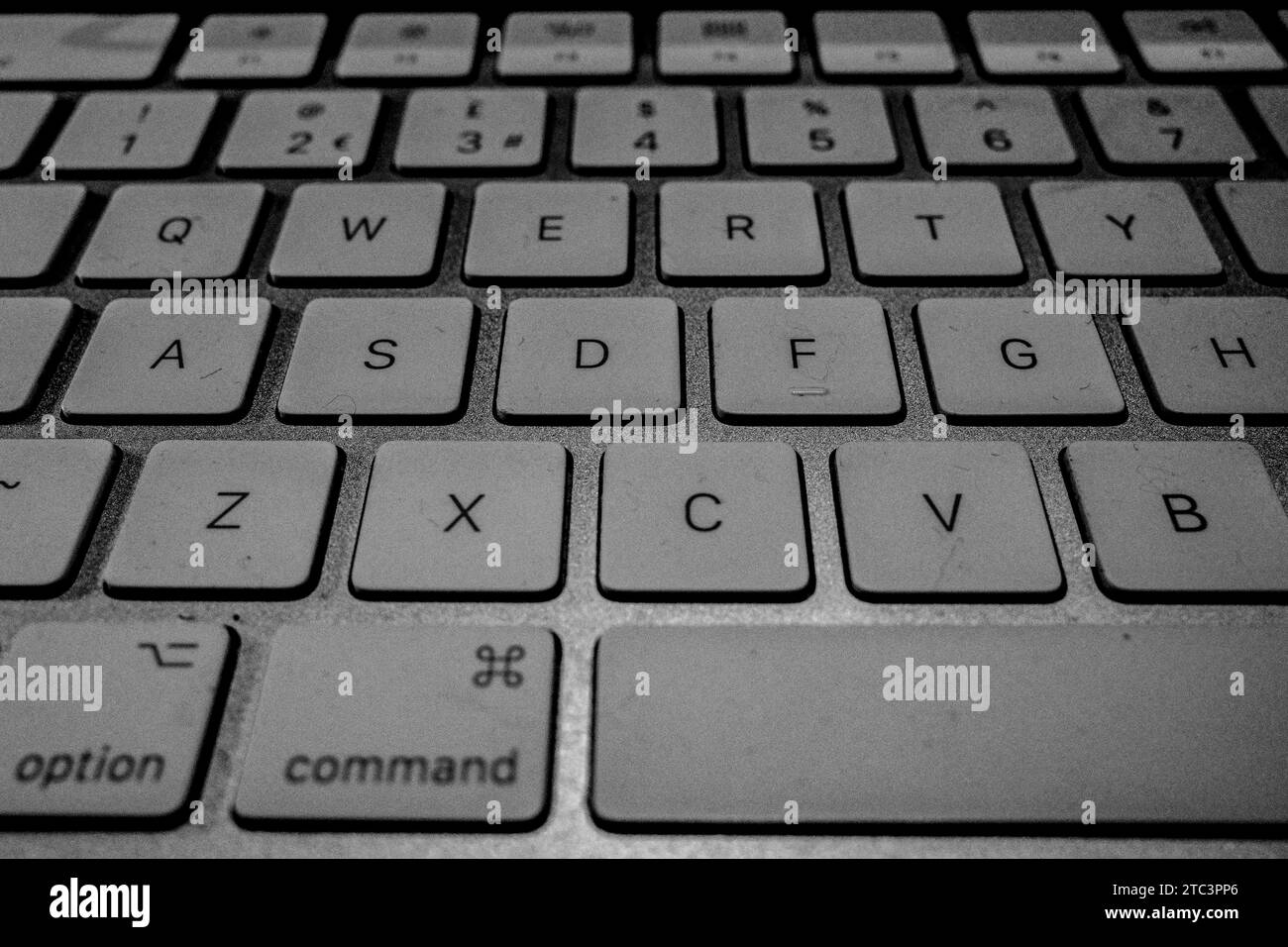 Close up of the typical Apple Mac Wireless Keyboard. Showing keys at an angle to fill the image. Command key. Concept, Abstract. Stock Photo