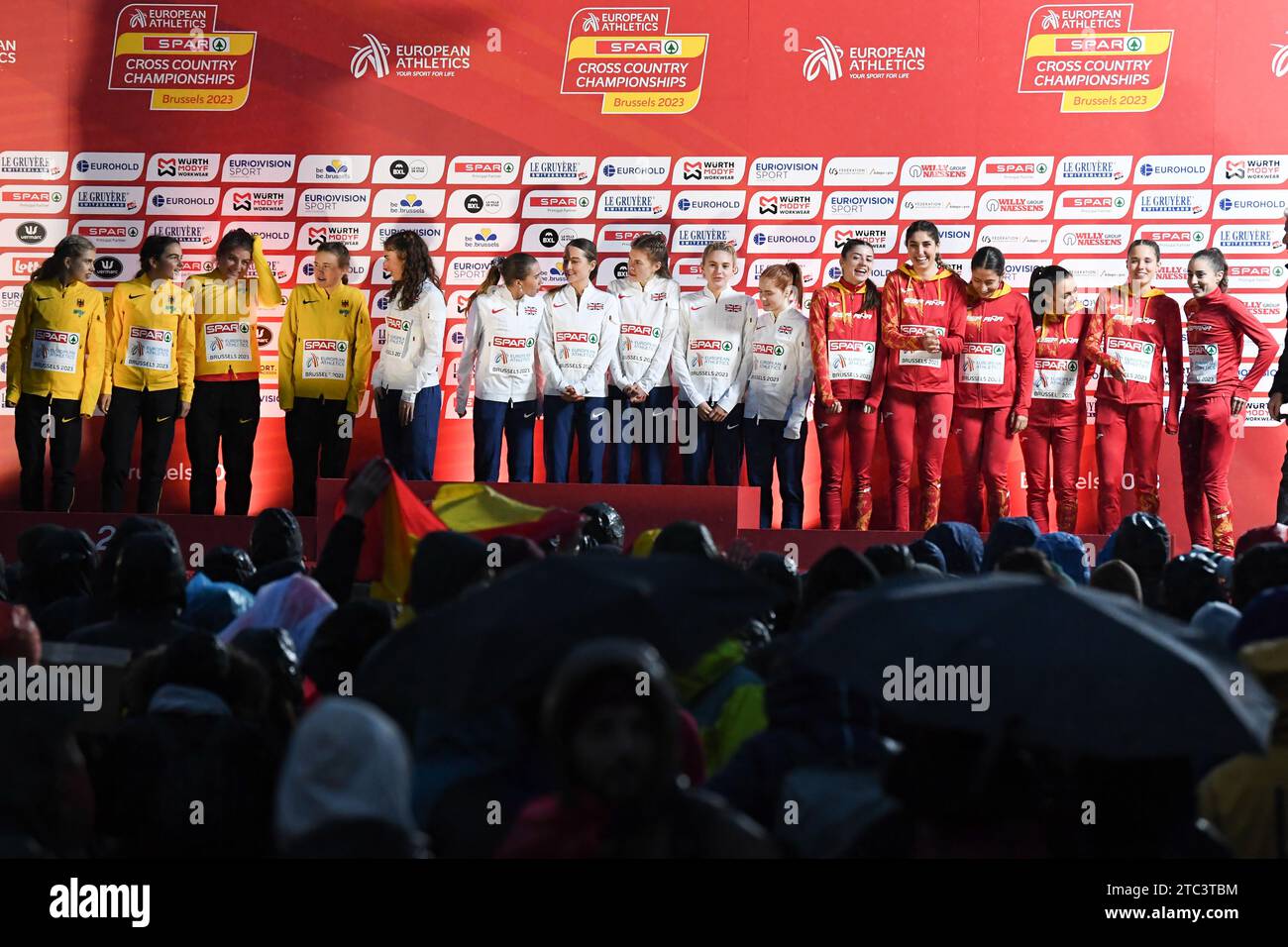 Brussels, Belgium. 10th Dec, 2023. German team, Great Britain team and Spanish team celebrate on the podium after the U23 women race at the European Cross Country Championships in Brussels, Sunday 10 December 2023 BELGA PHOTO JILL DELSAUX Credit: Belga News Agency/Alamy Live News Stock Photo