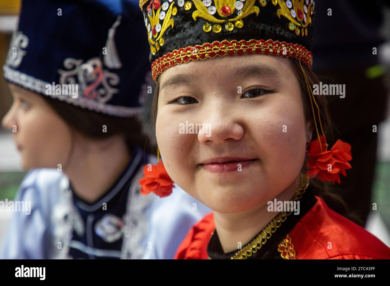 Moscow, Russia. 10th of December, 2023. A girl in a national costume at the stand of the Republic of Kalmykia during the Russia Expo international exhibition and forum at the VDNKh exhibition centre in Moscow, Russia Stock Photo