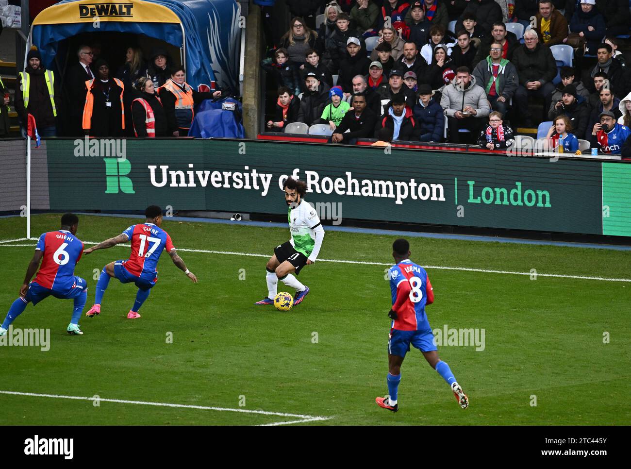 LONDON, ENGLAND - DECEMBER 9: Mohamed Salah of Liverpool FC and Nathaniel Clyne, Marc Guehi of Crystal Palace in action during the Premier League matc Stock Photo