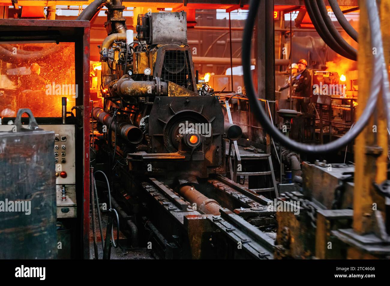 Iron pipe centrifugal pipe casting machine at the foundry. Stock Photo