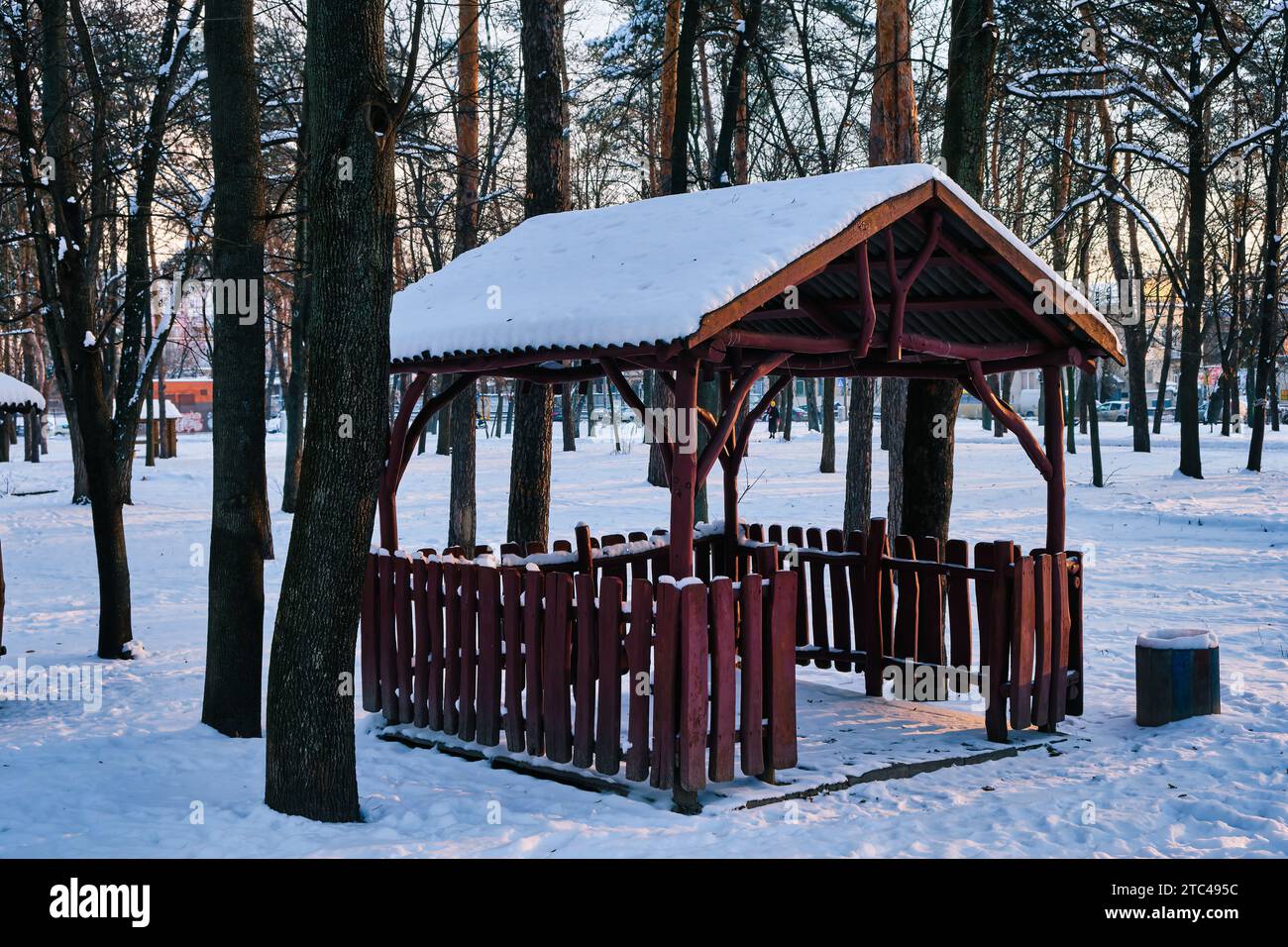 old wooden gazebo in a winter park on a sunny day. wooden gazebo in the ...