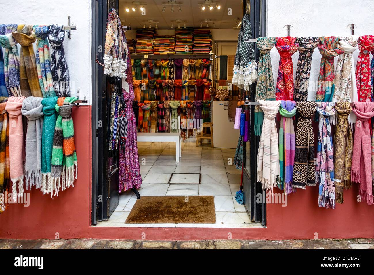 Colourful Scarf Display at Boutique Shop Entrance in Seville, Spain. Stock Photo