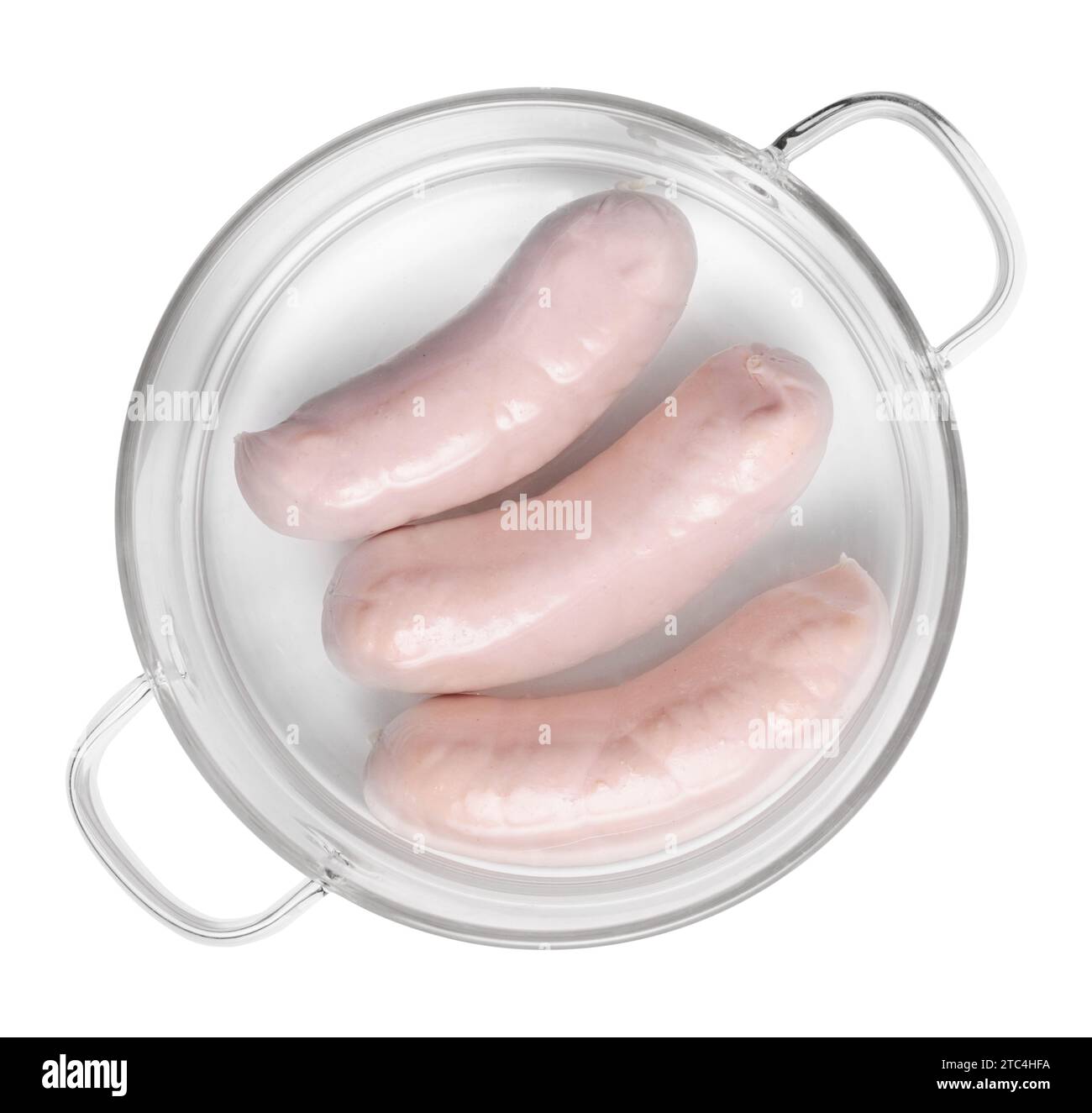 Three white sausages in a glass saucepan isolated on white background, top view Stock Photo