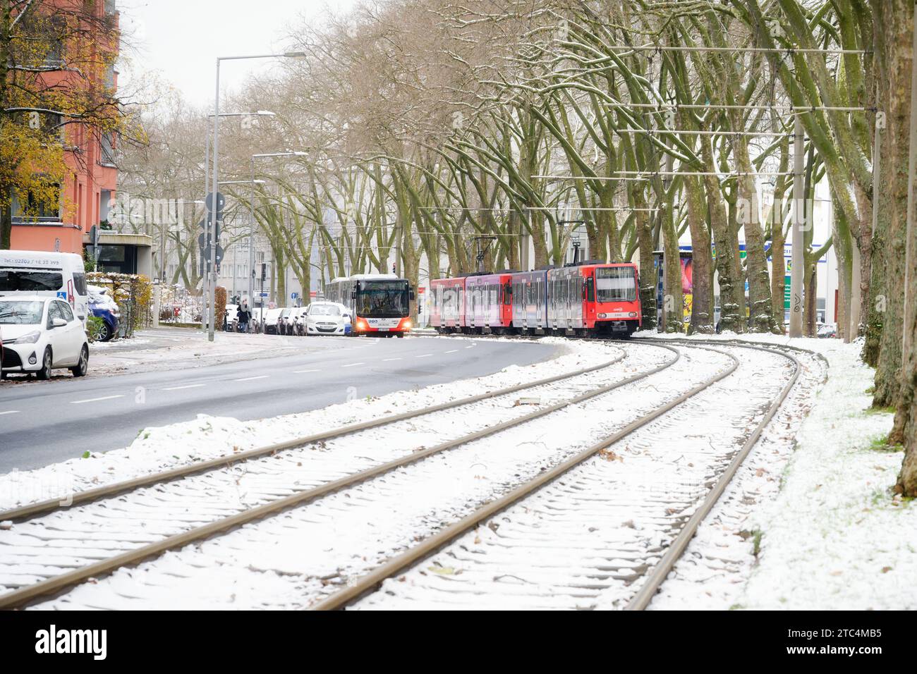 Cologne, Germany December 04 2023: tram, bus and car traffic after snowfall at melatengürtel in cologne ehrenfeld Stock Photo