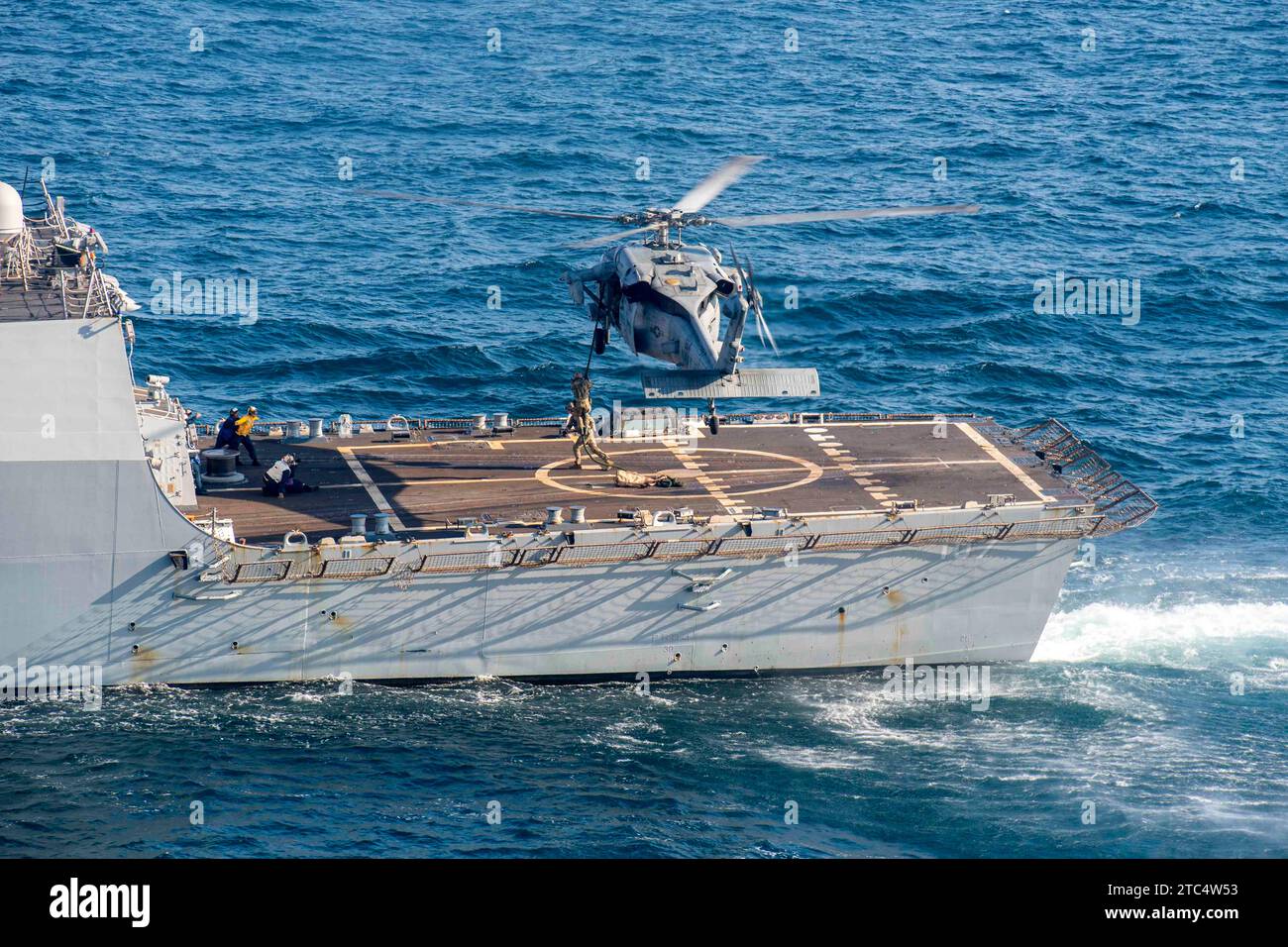 Ddg Rppe U.S. Navy Explosive Ordnance Disposal Technicians conduct helicopter ...