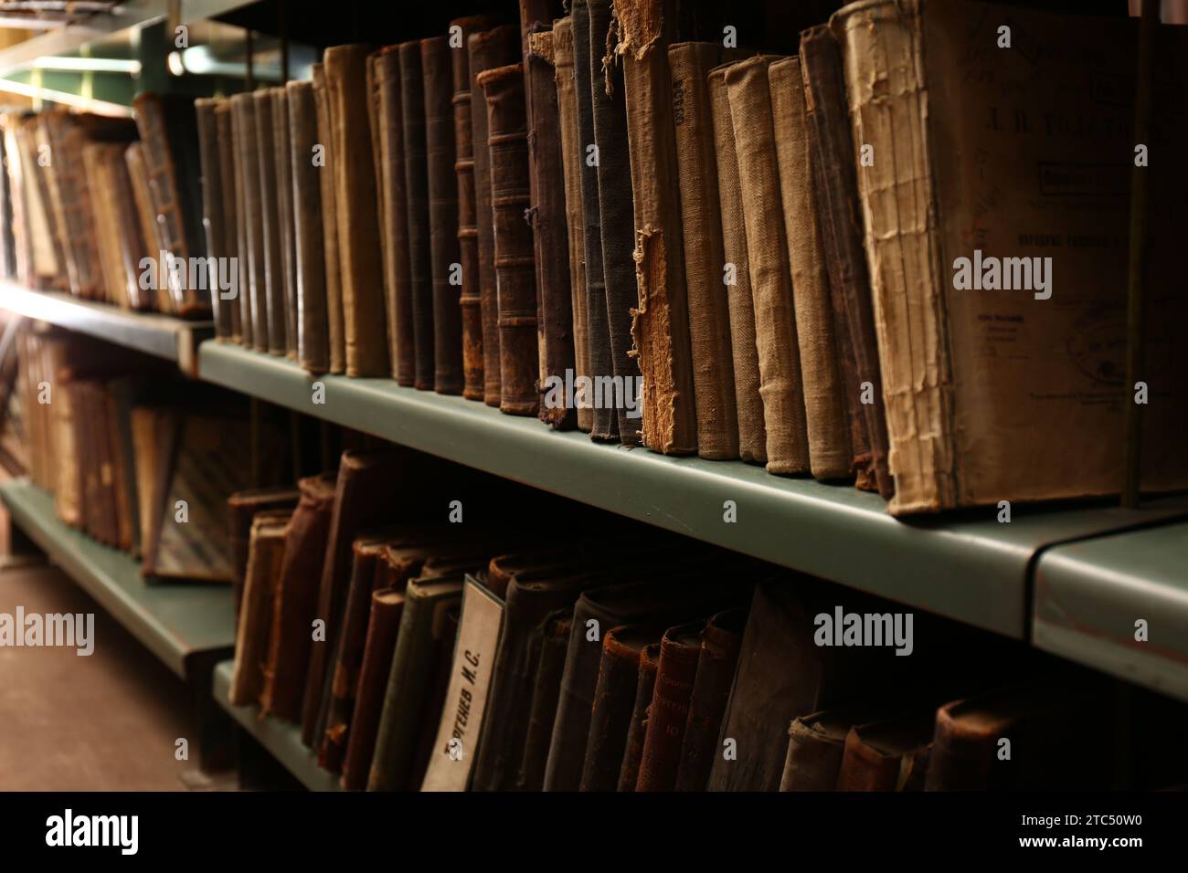 Collection of old books on shelves in library Stock Photo - Alamy