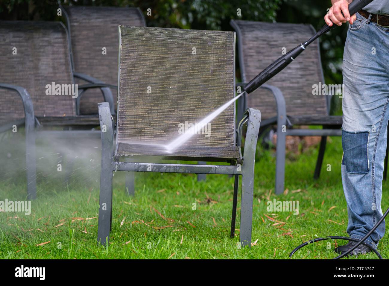 Cleaning outdoor furniture using a waterblaster Stock Photo - Alamy - Cleaning Outdoor Furniture