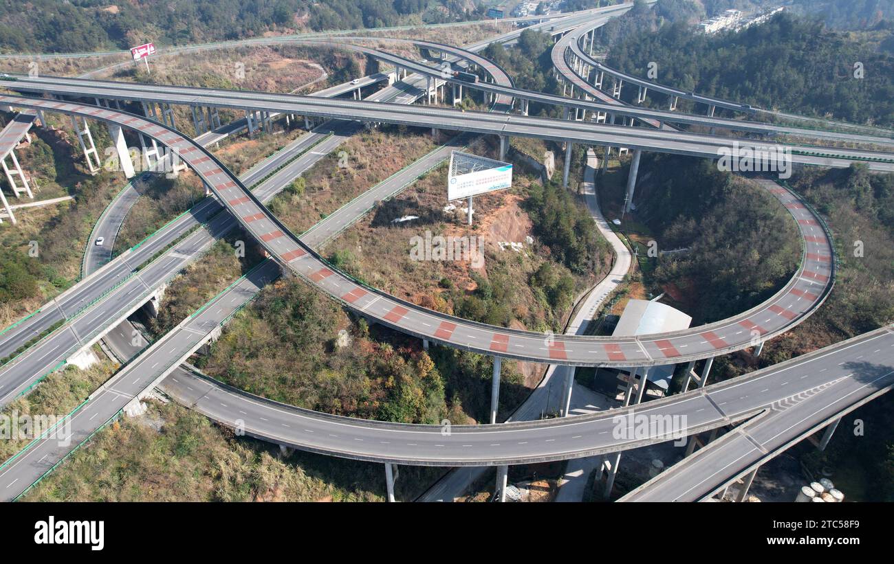 ENSHI, CHINA - DECEMBER 7, 2023 - Aerial photo shows a high-speed loop line in the mountains in Enshi City, Hubei Province, China, December 7, 2023. Stock Photo