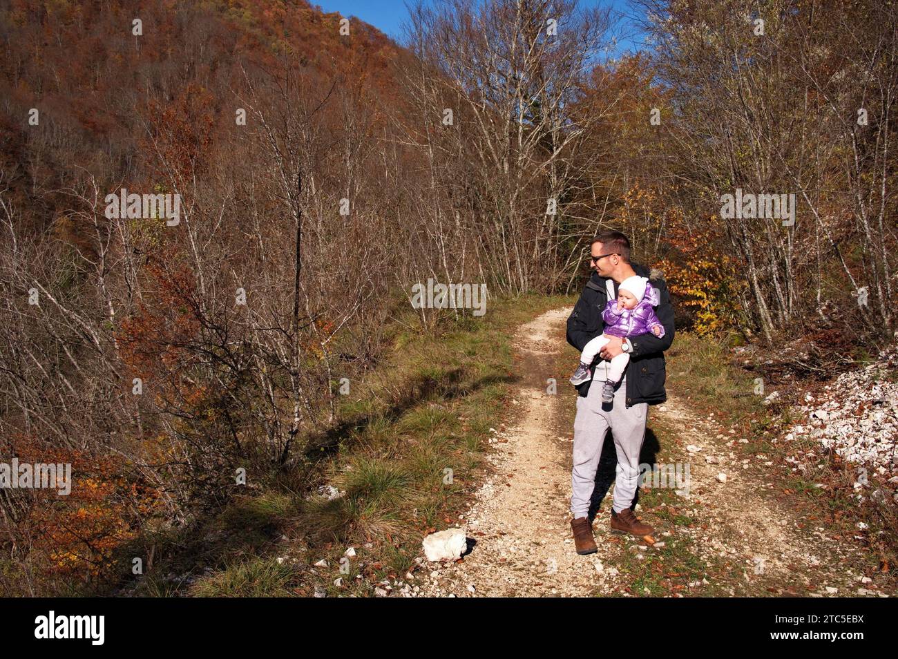 Father with little baby girl hiking in the forest Stock Photo