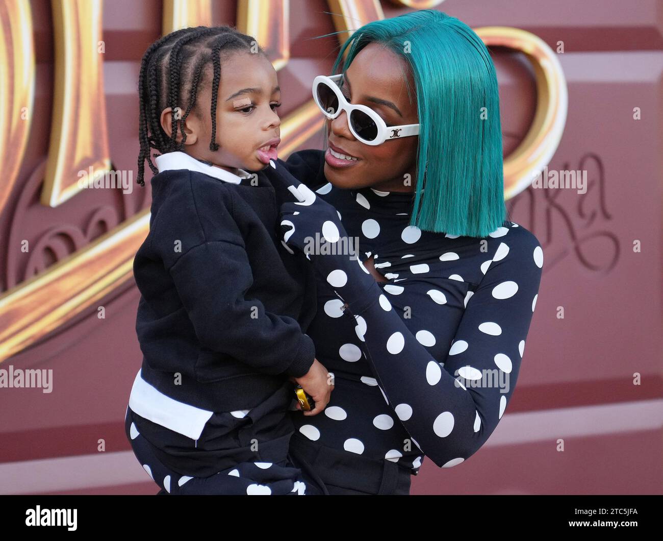 Los Angeles, USA. 10th Dec, 2023. Kelly Rowland and Son Noah Jon Weatherspoon arrives at the Warner Bros. Pictures' WONKA Los Angeles Premiere held at the Regency Village Theatre in Westwood, CA on Sunday, December 10, 2023. (Photo By Sthanlee B. Mirador/Sipa USA) Credit: Sipa USA/Alamy Live News Stock Photo