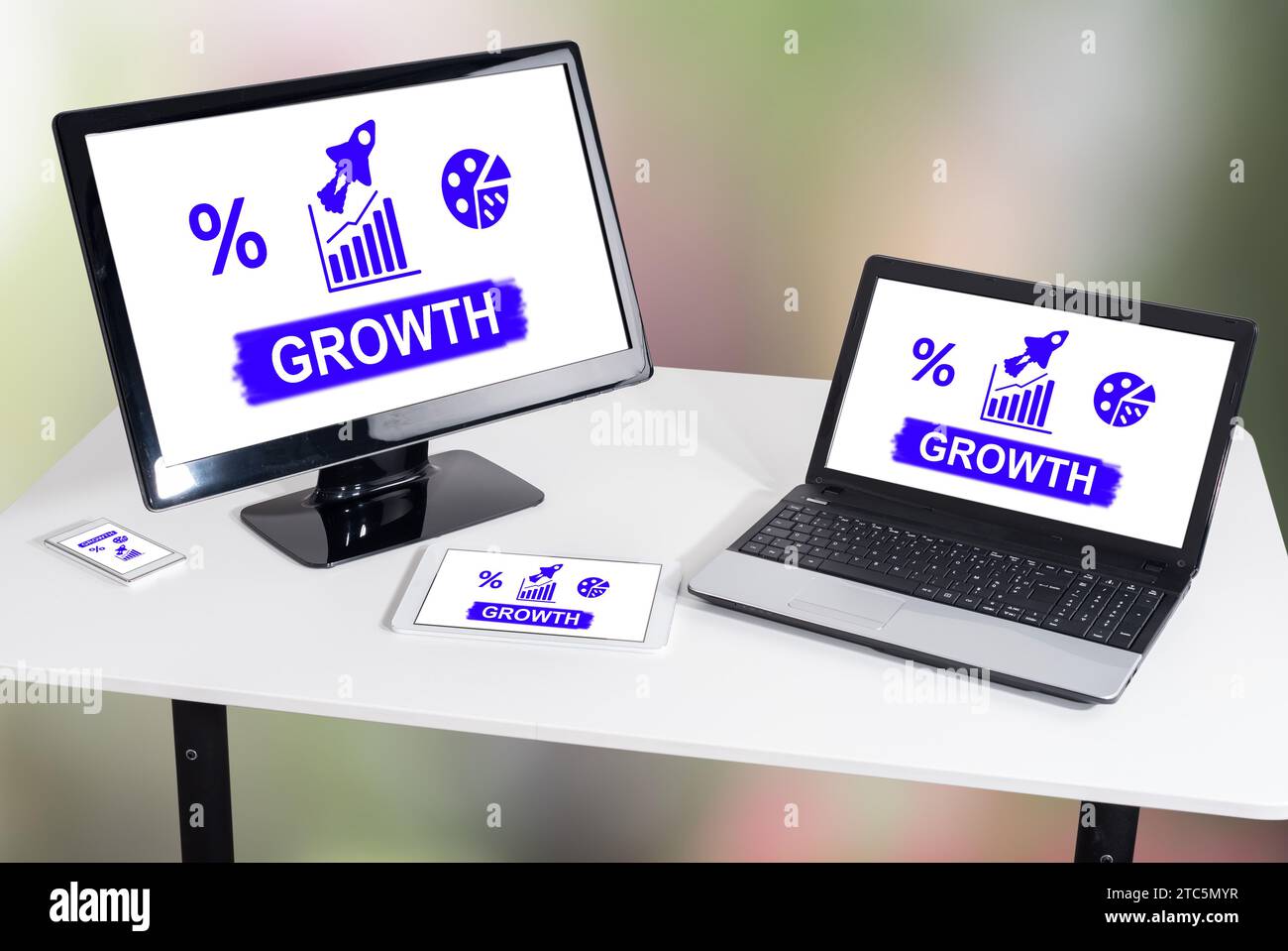 Growth concept shown on different information technology devices Stock Photo