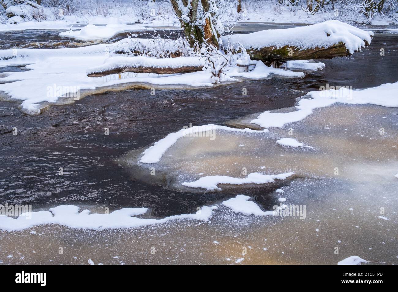 River with ice in a wintry landscape Stock Photo