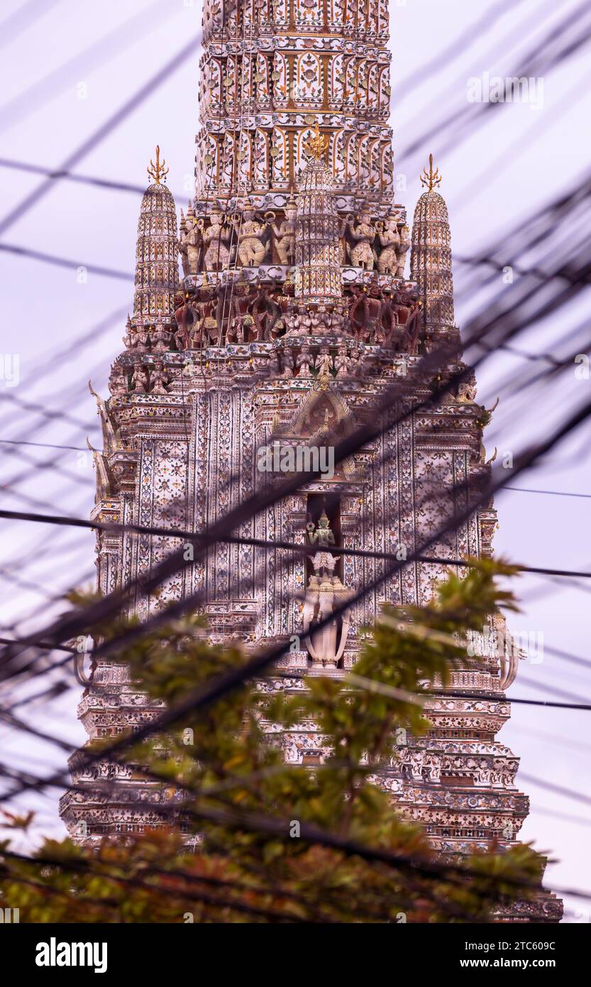 Wat Arun Temple amidst a tangle of cables that bring Bangkok city to life Stock Photo