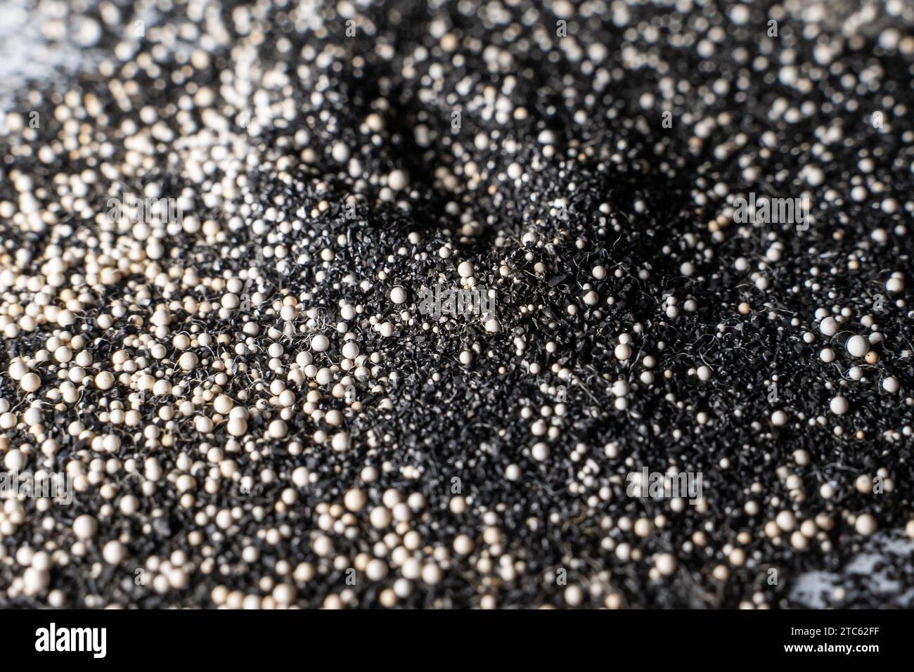 Universal filter composition made of ion exchange resins and activated carbon, close-up Stock Photo