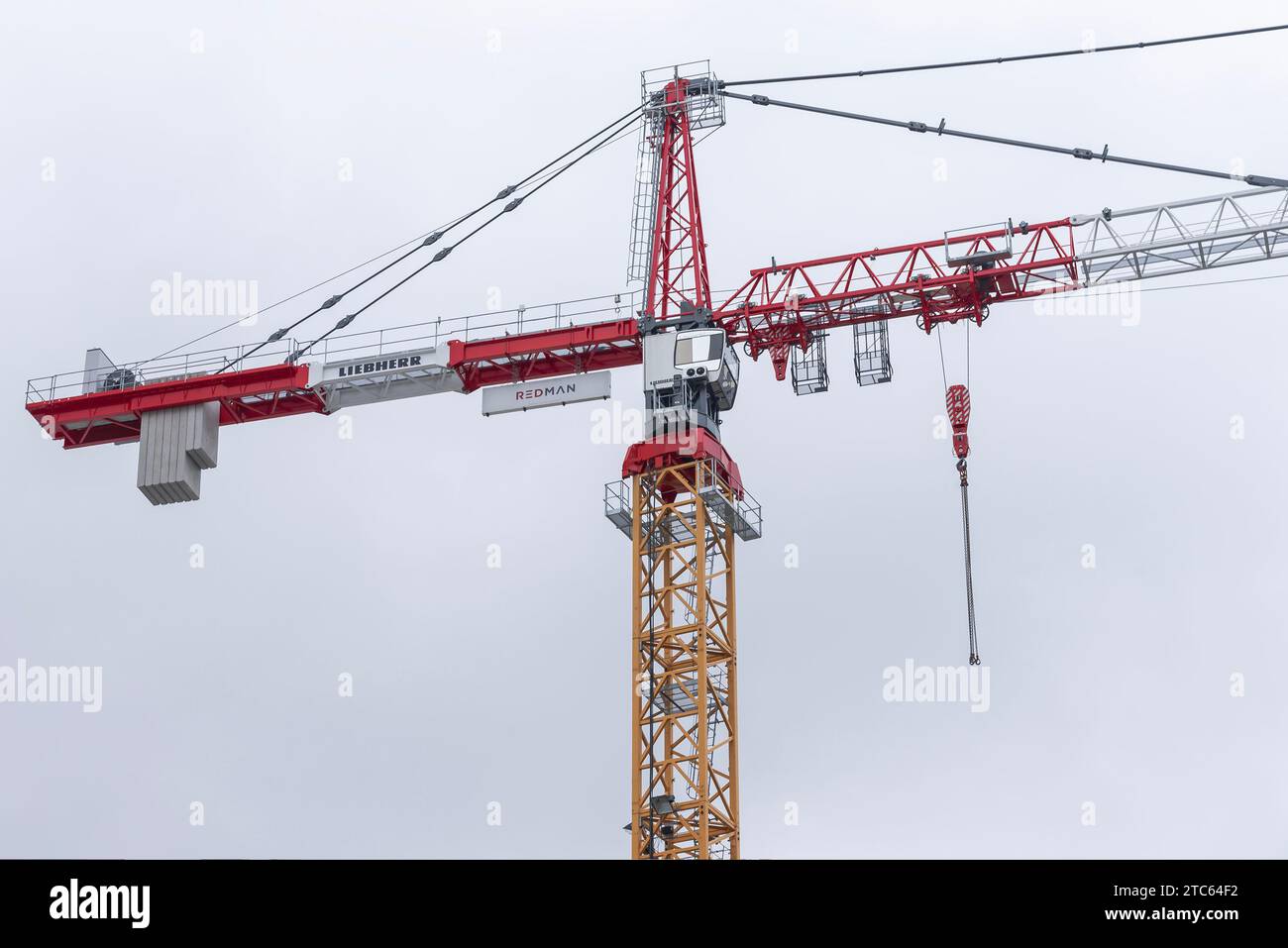 Paris, France - Red white and yellow tower crane Liebherr 630 EC-H 40 Litronic on a construction site. Stock Photo