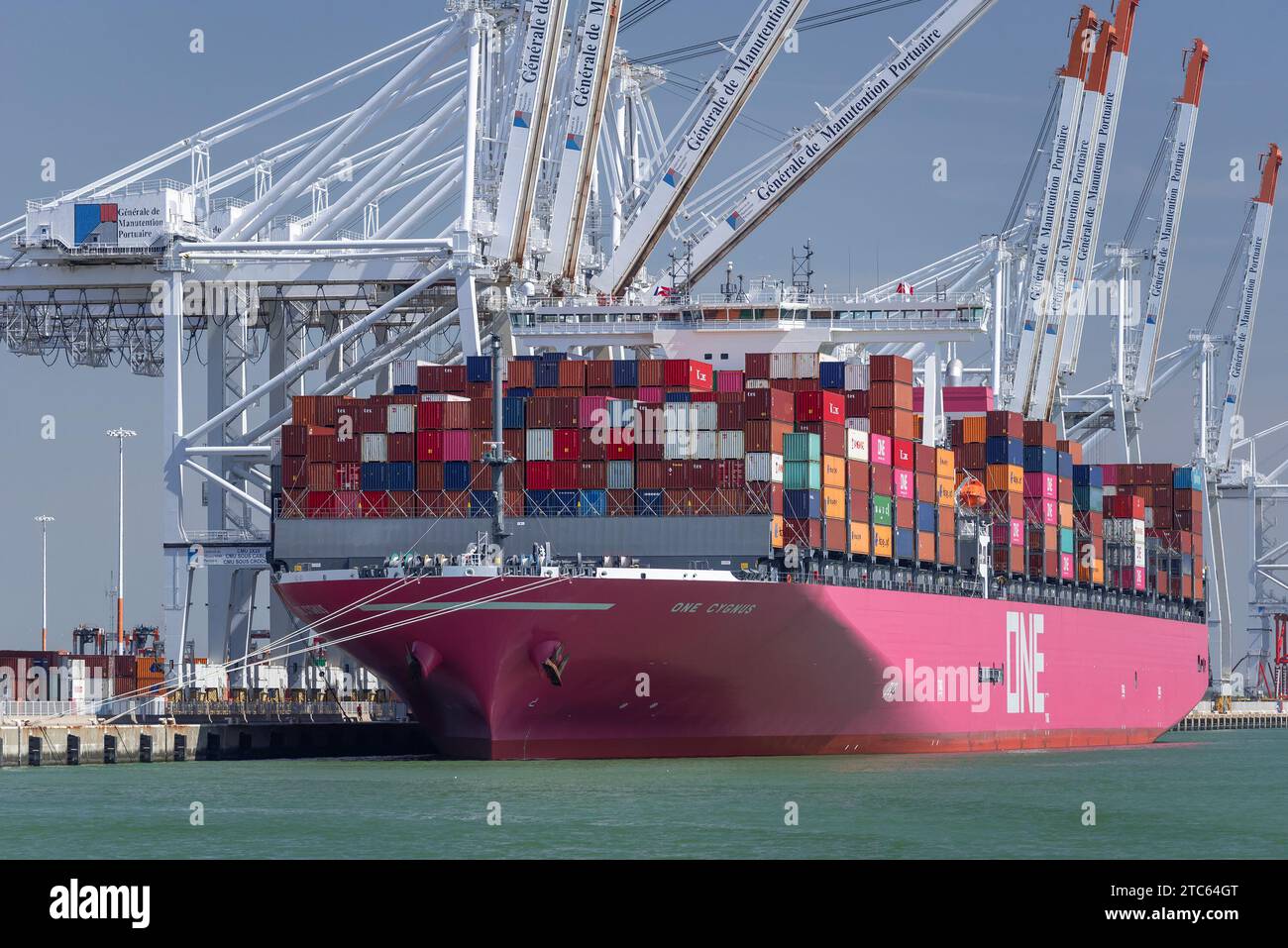 Le Havre, France - Container Ship ONE CYGNUS alongside at port of Le Havre with ship to shore container cranes. Stock Photo