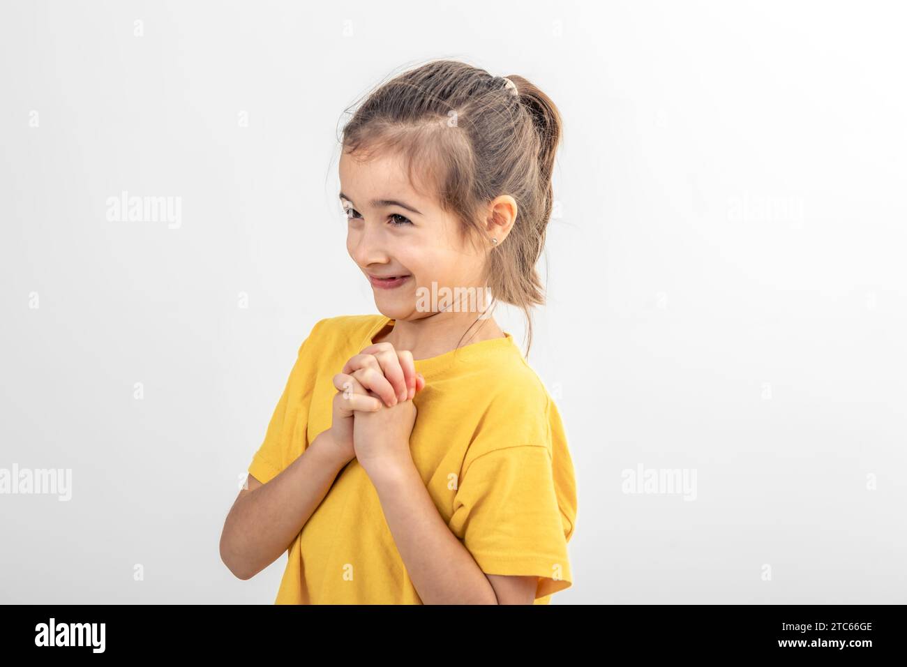 Cute little girl on a white background isolated Stock Photo - Alamy