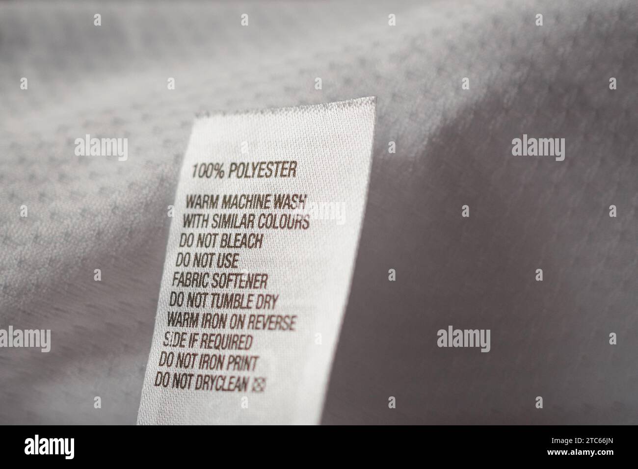 Polyester fabric Clothing label with laundry instructions Stock Photo ...