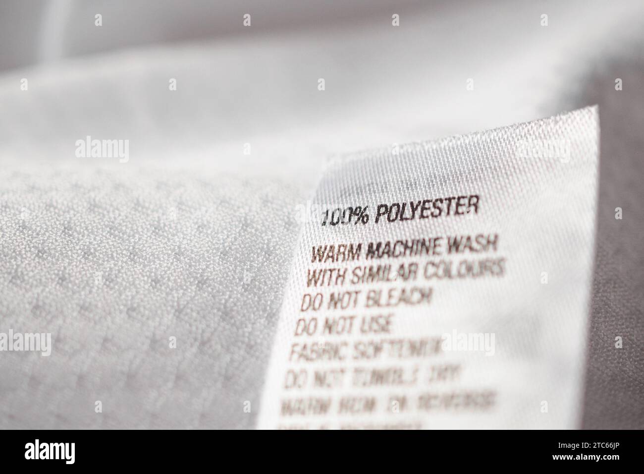 Polyester fabric Clothing label with laundry instructions Stock Photo ...