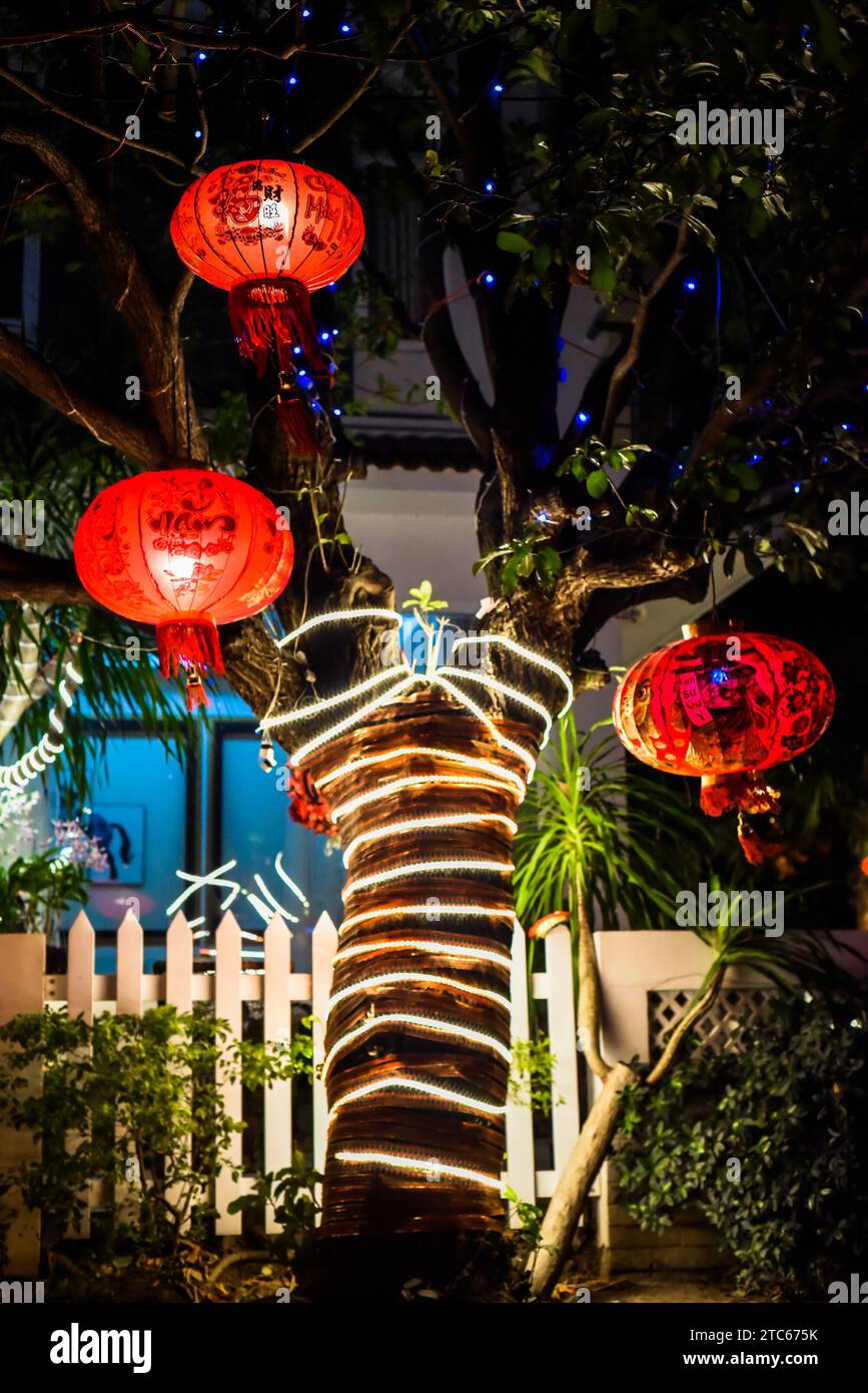 Many red lanterns with vietnamese language translated as "Happy New Year" hanging in Vietnam for