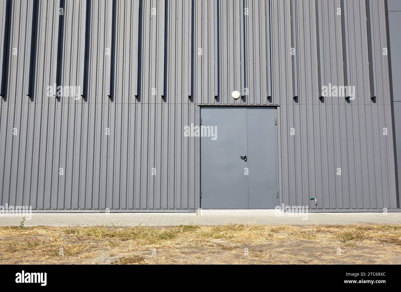 Corrugated steel warehouse or factory industrial building. Architecture