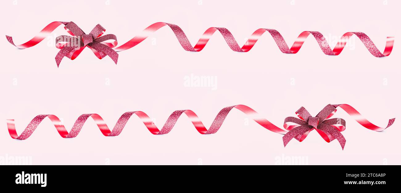 Gift Red Bow and ribbons Isolated on pink background with clipping path, holiday decorations. Stock Photo