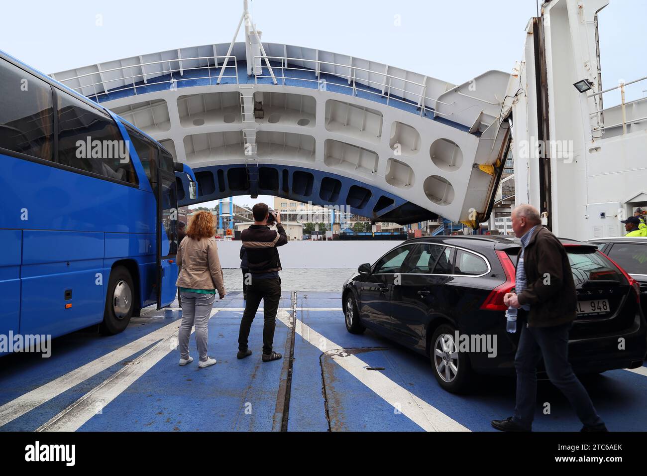 HELSINGBORG, SWEDEN - JUNE 30, 2016: An unidentified man takes pictures of the moment the ferry arrives in Sweden. Stock Photo