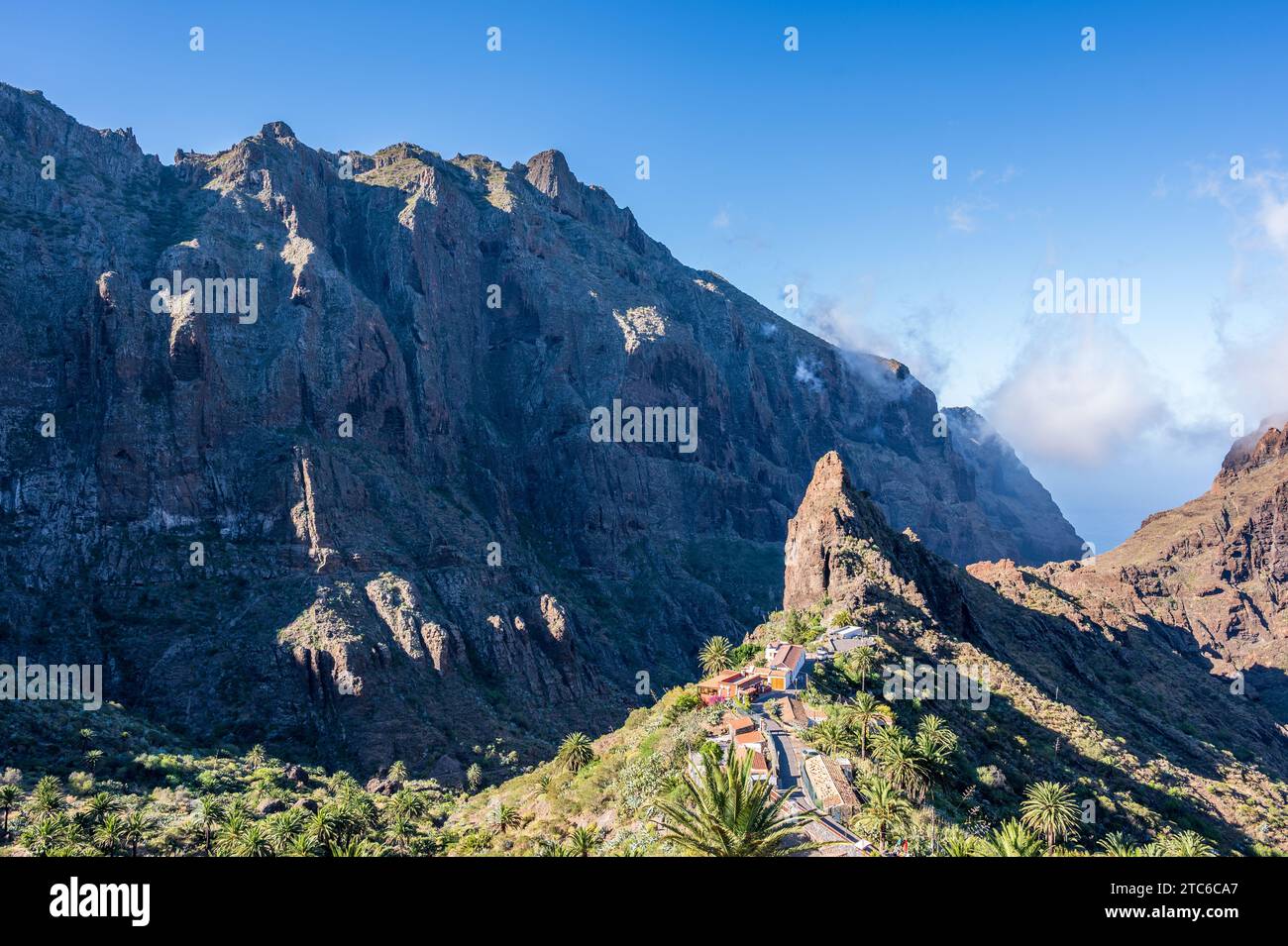 View of Masca, a small mountain village on the island of Tenerife, from above. The village is situated above the Los Gigantes cliffs, the highest clif Stock Photo
