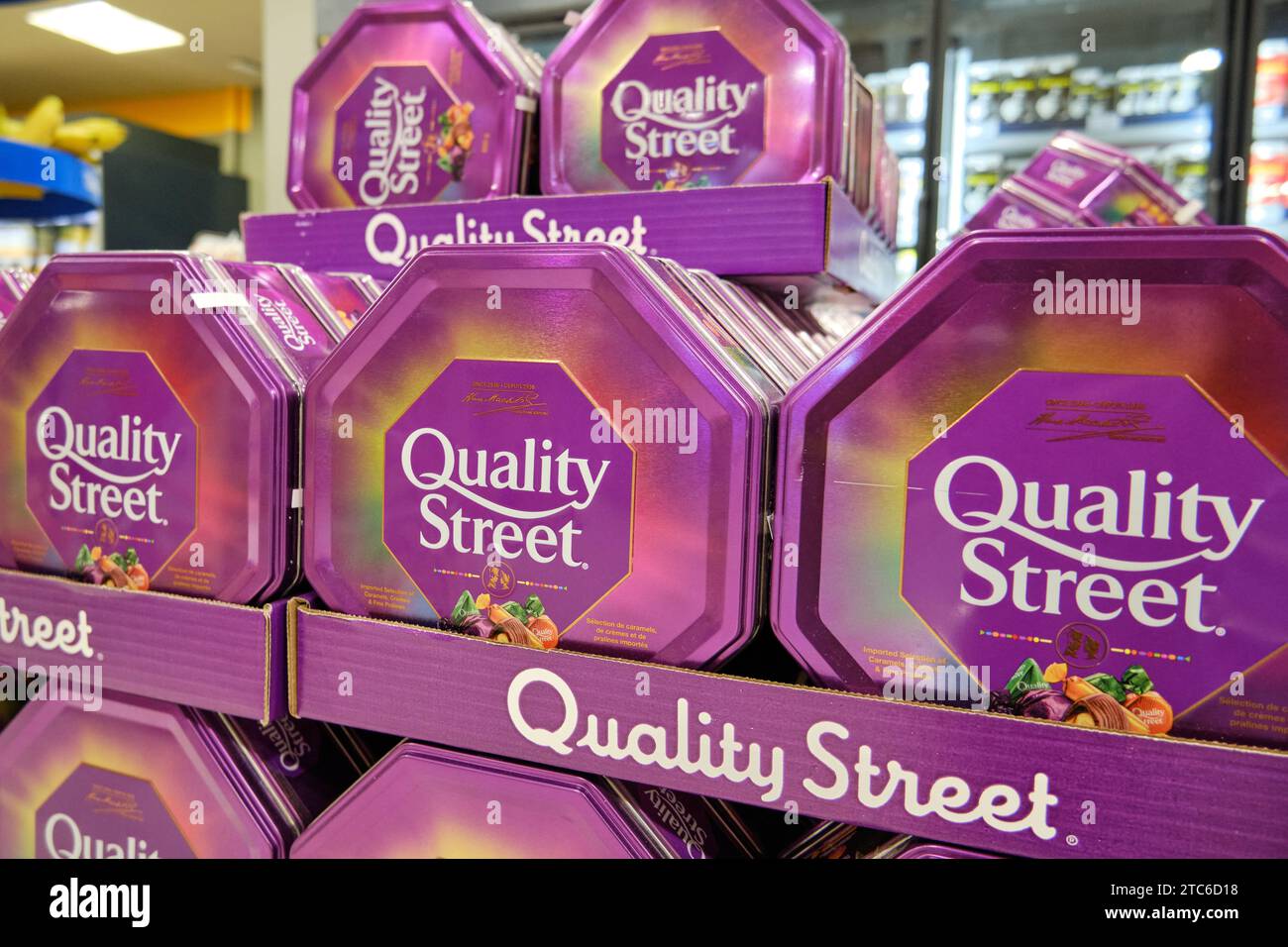 Supermarket stacked display of Quality Street chocolate boxes Stock Photo
